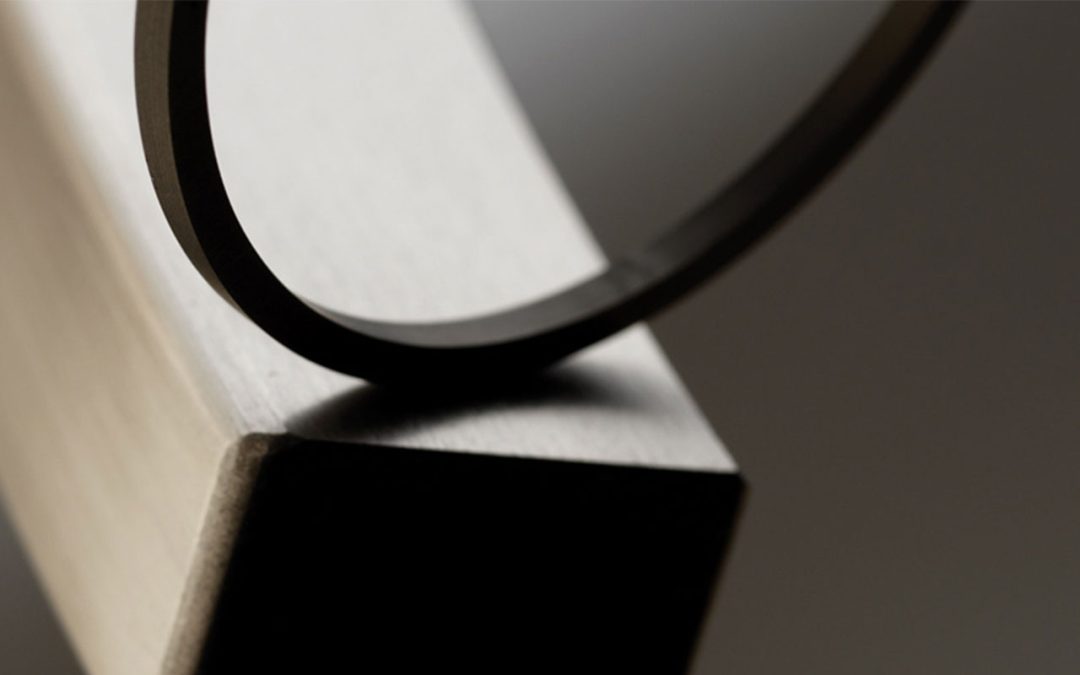A piston ring and cylinder block showing the space between them